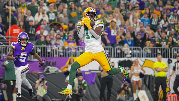 Green Bay Packers wide receiver Jayden Reed catches a touchdown pass at the Minnesota Vikings last year.