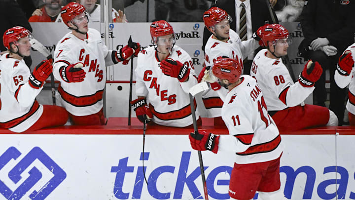 Jan 20, 2025; Chicago, Illinois, USA;  Carolina Hurricanes center Jordan Staal (11) celebrates with teammates  after scoring a goal against the Chicago Blackhawks during the third period at the United Center. Mandatory Credit: Matt Marton-Imagn Images