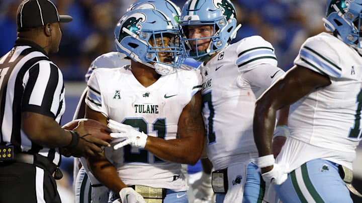 Oct 13, 2023; Memphis, Tennessee, USA; Tulane Green Wave quarterback Michael Pratt (right) reacts with running back Makhi Hughes (21) after a touchdown during the first half against the Memphis Tigers at Simmons Bank Liberty Stadium. Mandatory Credit: Petre Thomas-Imagn Images