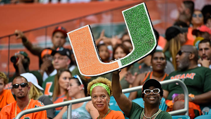 A Miami Hurricanes fan holds a school logo sign during the first half against the Savannah State Tigers at Hard Rock Stadium. 