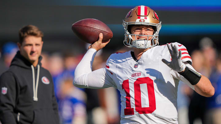 Nov 2, 2025; East Rutherford, New Jersey, USA; San Francisco 49ers quarterback Mac Jones (10) warms up prior to a game against the New York Giants at MetLife Stadium. Mandatory Credit: Robert Deutsch-Imagn Images