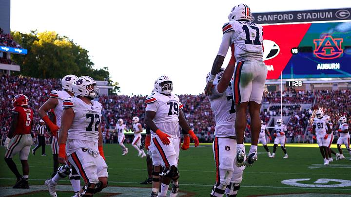 Oct 17, 2026; Athens, Georgia, USA;  Auburn quarterback Byrum Brown (17) celebrates with teammates following a touchdown during the fourth quarter against Georgia at Sanford Stadium.  Mandatory Credit: Dale Zanine-Imagn Images