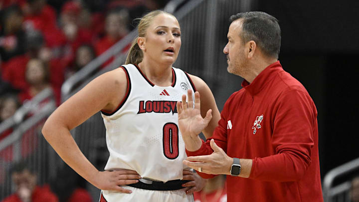 Mar 1, 2026; Louisville, Kentucky, USA; Louisville Cardinals head coach Jeff Walz talks with forward Laura Ziegler (0) during the first half against the Notre Dame Fighting Irish at KFC Yum! Center. Mandatory Credit: Jamie Rhodes-Imagn Images Mar 1, 2026; Louisville, Kentucky, USA; Louisville Cardinals head coach Jeff Walz talks with forward Laura Ziegler (0) during the first half against the Notre Dame Fighting Irish at KFC Yum! Center. Mandatory Credit: Jamie Rhodes-Imagn Images