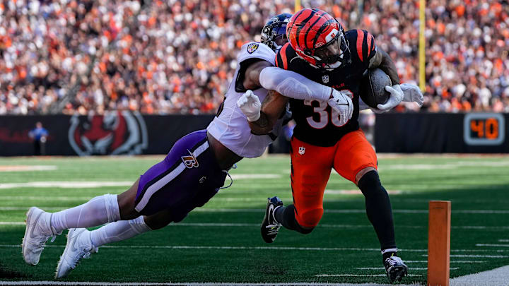 Cincinnati Bengals halfback Chase Brown (30) runs the ball in for a touchdown in the fourth quarter of the NFL Week 5 game between the Cincinnati Bengals and Baltimore Ravens at Paycor Stadium in downtown Cincinnati on Sunday, Oct. 6, 2024. The Bengals fell to 1-4 on the season with a 41-38 loss to the Ravens. Cincinnati Bengals halfback Chase Brown (30) runs the ball in for a touchdown in the fourth quarter of the NFL Week 5 game between the Cincinnati Bengals and Baltimore Ravens at Paycor Stadium in downtown Cincinnati on Sunday, Oct. 6, 2024. The Bengals fell to 1-4 on the season with a 41-38 loss to the Ravens.