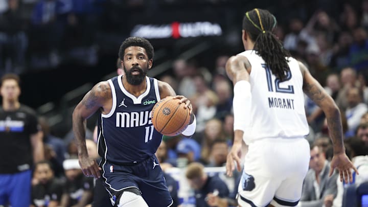 Dallas Mavericks guard Kyrie Irving (11) dribbles as Memphis Grizzlies guard Ja Morant (12) defends during the first quarter at American Airlines Center. Mandatory Credit: Kevin Jairaj-Imagn Images