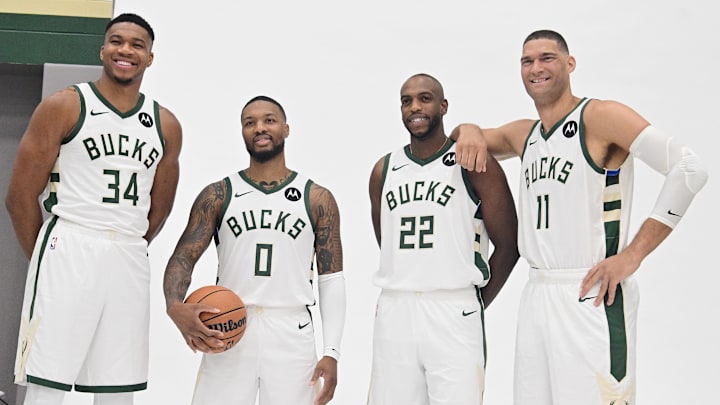 Oct 2, 2023; Milwaukee, WI, USA; Milwaukee Bucks forward Giannis Antetokounmpo (34), guard Damian Lillard (0), forward Khris Middleton (22), and center Brook Lopez (11) pose for a picture during media day in Milwaukee. Mandatory Credit: Benny Sieu-Imagn Images Oct 2, 2023; Milwaukee, WI, USA; Milwaukee Bucks forward Giannis Antetokounmpo (34), guard Damian Lillard (0), forward Khris Middleton (22), and center Brook Lopez (11) pose for a picture during media day in Milwaukee. Mandatory Credit: Benny Sieu-Imagn Images