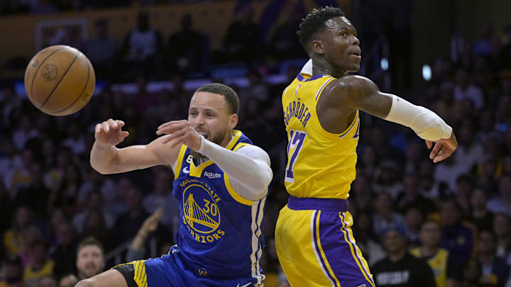 May 12, 2023; Los Angeles, California, USA; Golden State Warriors guard Stephen Curry (30) is fouled by Los Angeles Lakers guard Dennis Schroder (17) as they go up for a rebound in the first half of game six of the 2023 NBA playoffs at Crypto.com Arena. Mandatory Credit: Jayne Kamin-Oncea-Imagn Images