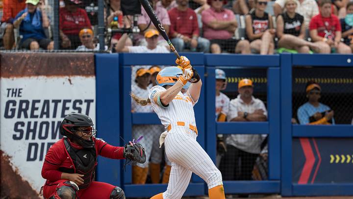 May 30, 2026; Oklahoma City, OK, USA;  Tennessee Lady Volunteers outfielder Taelyn Holley (27) hits a solo home run in the fifth inning against the Texas Tech Red Raiders during the NCAA Women’s College World Series at Devon Park. Mandatory Credit: Brett Rojo-Imagn Images