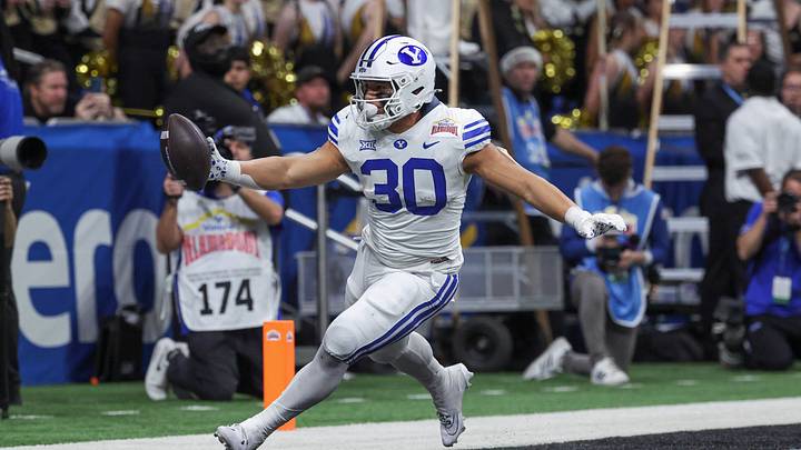 Dec 28, 2024; San Antonio, TX, USA; Brigham Young Cougars running back Sione I Moa (30) scores a touchdown during the third quarter against the Colorado Buffaloes at Alamodome. Mandatory Credit: Troy Taormina-Imagn Images