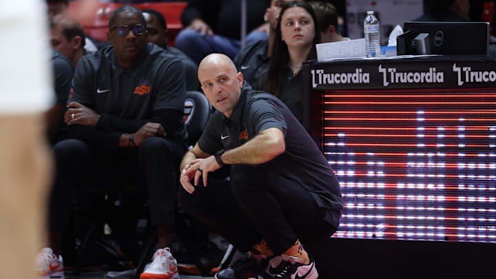 Jan 31, 2026; Salt Lake City, Utah, USA; Oklahoma State Cowboys head coach Steve Lutz watches play during the second half of the game against the Utah Utes at Jon M. Huntsman Center. Mandatory Credit: Rob Gray-Imagn Images