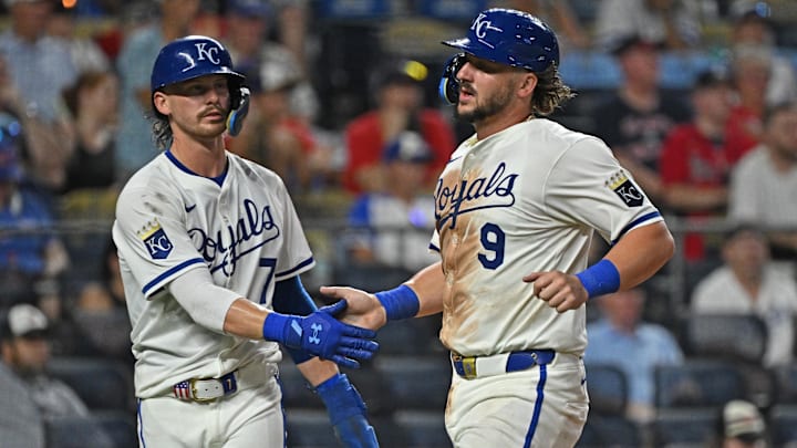 Jul 28, 2025; Kansas City, Missouri, USA;  Kansas City Royals first baseman Vinnie Pasquantino (9) shakes hands with teammate shortstop Bobby Witt Jr. (7) after scoring a run in the ninth inning against the Atlanta Braves at Kauffman Stadium. Mandatory Credit: Peter Aiken-Imagn Images