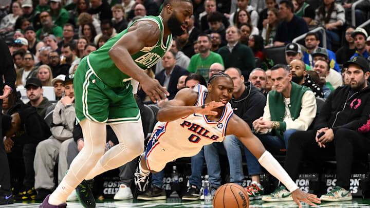 Apr 21, 2026; Boston, Massachusetts, USA; Boston Celtics guard Jaylen Brown (7) and Philadelphia 76ers guard Tyrese Maxey (0) dive for the ball  in the first half of a game two of the first round of the 2026 NBA Playoffs at TD Garden. Mandatory Credit: Brian Fluharty-Imagn Images