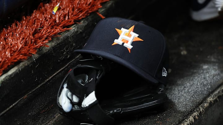 Mar 28, 2019; St. Petersburg, FL, USA; A detail view of a Houston Astros baseball hat and glove lay in the dugout at Tropicana Field. Mandatory Credit: Kim Klement-Imagn Images