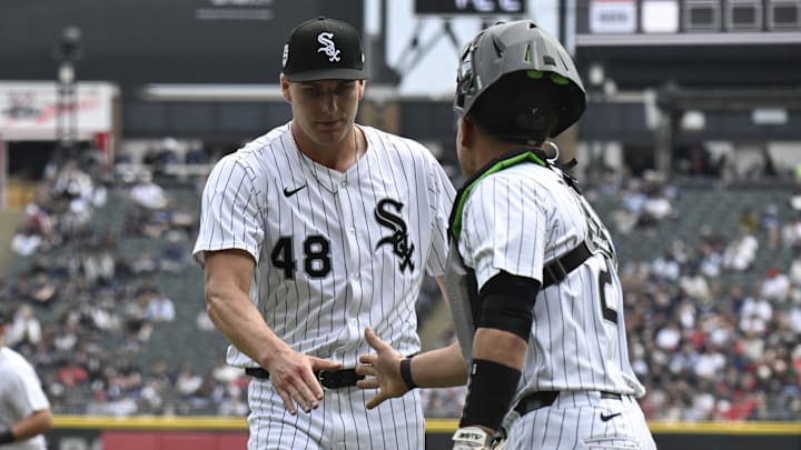 Chicago White Sox pitcher Jonathan Cannon (48) high fives catcher Matt Thaiss (29) against the Los Angeles Angels at Rate Field. Chicago White Sox pitcher Jonathan Cannon (48) high fives catcher Matt Thaiss (29) against the Los Angeles Angels at Rate Field.
