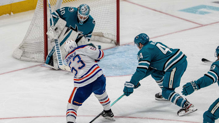 Apr 16, 2025; San Jose, California, USA;  San Jose Sharks goaltender Alexandar Georgiev (40) makes a save against Edmonton Oilers center Jeff Skinner (53) during the third period at SAP Center at San Jose. Mandatory Credit: Neville E. Guard-Imagn Images