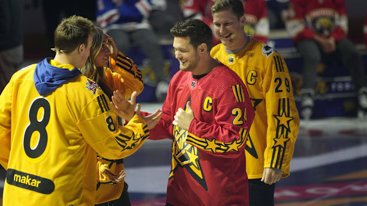 Feb 1, 2024; Toronto, Ontario, CANADA; Team Hughes celebrity captain Michael Buble (24) shakes hands with Colorado Avalanche defenceman Cale Makar (8) as Team MacKinnon captain Nathan MacKinnon (29) looks on during the NHL All-Star Player Draft on NHL All-Star Thursday at Scotiabank Arena. Mandatory Credit: John E. Sokolowski-Imagn Images Feb 1, 2024; Toronto, Ontario, CANADA; Team Hughes celebrity captain Michael Buble (24) shakes hands with Colorado Avalanche defenceman Cale Makar (8) as Team MacKinnon captain Nathan MacKinnon (29) looks on during the NHL All-Star Player Draft on NHL All-Star Thursday at Scotiabank Arena. Mandatory Credit: John E. Sokolowski-Imagn Images