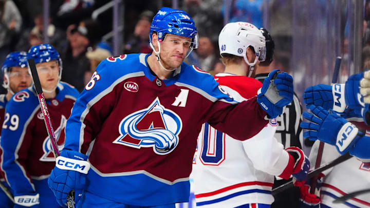 Jan 4, 2025; Denver, Colorado, USA; Colorado Avalanche right wing Mikko Rantanen (96) celebrates after scoring a goal against the Montreal Canadiens in the first period at Ball Arena. Mandatory Credit: Ron Chenoy-Imagn Images