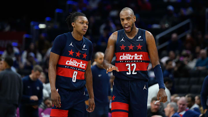 Mar 5, 2025; Washington, District of Columbia, USA; Washington Wizards forward Khris Middleton (32) and guard Bub Carrington (8) talk during the third quarter against the Utah Jazz at Capital One Arena. Mandatory Credit: Reggie Hildred-Imagn Images