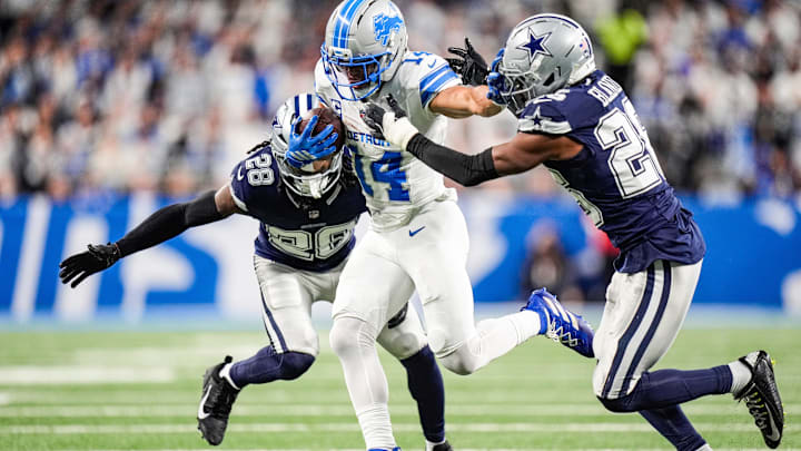 Dec 4, 2025; Detroit, Michigan, USA; Detroit Lions wide receiver Amon-Ra St. Brown (14) makes a catch against Dallas Cowboys safety Malik Hooker (28) and cornerback DaRon Bland (26) during the first half at Ford Field. Mandatory Credit: Junfu Han-USA TODAY Network via Imagn Images Dec 4, 2025; Detroit, Michigan, USA; Detroit Lions wide receiver Amon-Ra St. Brown (14) makes a catch against Dallas Cowboys safety Malik Hooker (28) and cornerback DaRon Bland (26) during the first half at Ford Field. Mandatory Credit: Junfu Han-USA TODAY Network via Imagn Images