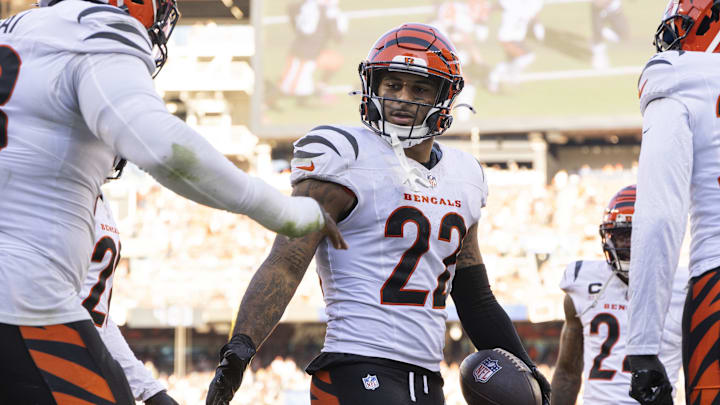 Oct 20, 2024; Cleveland, Ohio, USA; Cincinnati Bengals safety Geno Stone (22) and teammates celebrate his interception during the fourth quarter against the Cleveland Browns at Huntington Bank Field. Mandatory Credit: Scott Galvin-Imagn Images