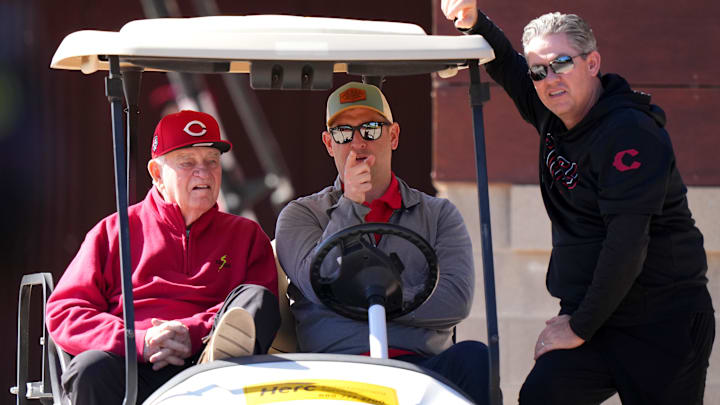 Feb 19, 2024; Goodyear, AZ, USA; From left; Cincinnati Reds CEO Bob Castellini, president of baseball operations Nick Krall and senior vice president and general manager Brad Meador talk during spring training workouts at Goodyear Ballpark. Mandatory Credit: Kareem Elgazzar-Imagn Images Feb 19, 2024; Goodyear, AZ, USA; From left; Cincinnati Reds CEO Bob Castellini, president of baseball operations Nick Krall and senior vice president and general manager Brad Meador talk during spring training workouts at Goodyear Ballpark. Mandatory Credit: Kareem Elgazzar-Imagn Images