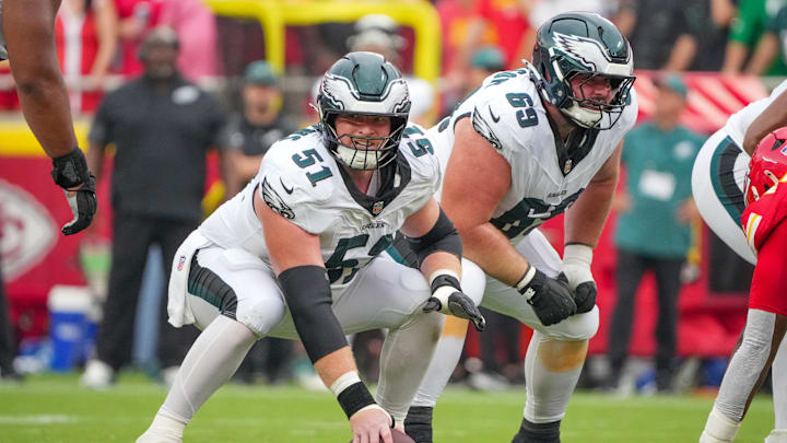 Sep 14, 2025; Kansas City, Missouri, USA; Philadelphia Eagles center Cam Jurgens (51) and guard Landon Dickerson (69) at the line of scrimmage against the Kansas City Chiefs during the second half of the game at GEHA Field at Arrowhead Stadium. Mandatory Credit: Denny Medley-Imagn Images