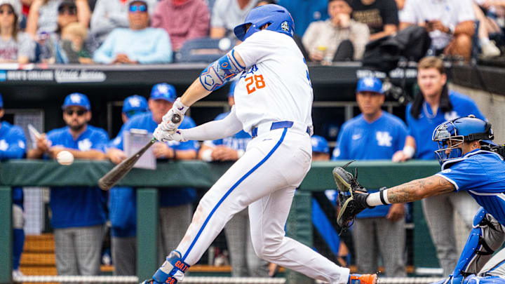 Florida catcher Luke Heyman hits an RBI single in an NCAA World Series game against Kentucky on June 19, 2024, at Charles Schwab Field.