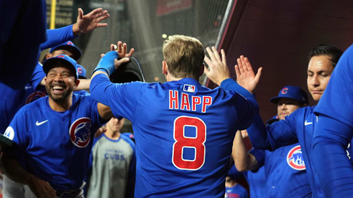 Mar 27, 2025; Phoenix, Arizona, USA; Chicago Cubs outfielder Ian Happ (8) celebrates after scoring a run against the Arizona Diamondbacks during the second inning at Chase Field.