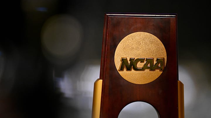 Apr 19, 2025; Fort Worth, TX, USA; A view of the NCAA logo and trophy before the 2025 Women's National Gymnastics Championship at Dickies Arena. Mandatory Credit: Jerome Miron-Imagn Images Apr 19, 2025; Fort Worth, TX, USA; A view of the NCAA logo and trophy before the 2025 Women's National Gymnastics Championship at Dickies Arena. Mandatory Credit: Jerome Miron-Imagn Images