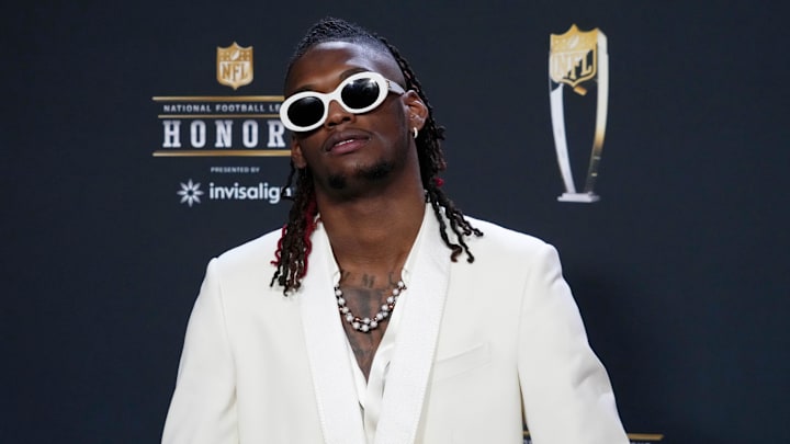 CeeDee Lamb poses for a photo on the red carpet before the NFL Honors award show at Symphony Hall. 