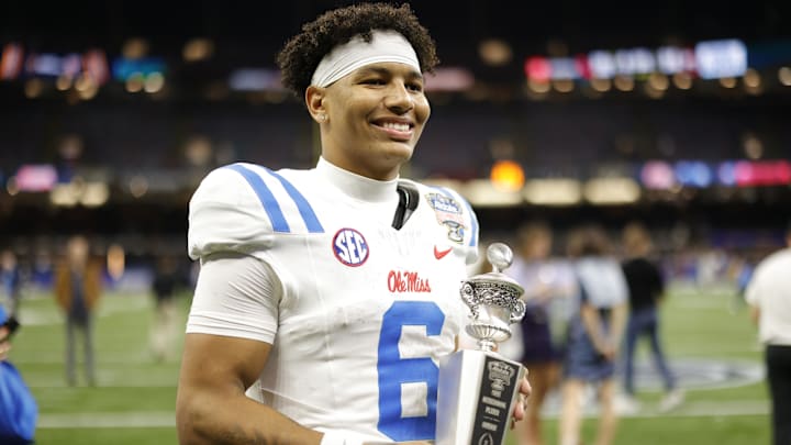 Jan 1, 2026; New Orleans, LA, USA; Mississippi Rebels quarterback Trinidad Chambliss (6) poses for a photo with the MVP trophy after the 2026 Sugar Bowl and quarterfinal game of the College Football Playoff against the Georgia Bulldogs at Caesars Superdome. Mandatory Credit: Amber Searls-Imagn Images