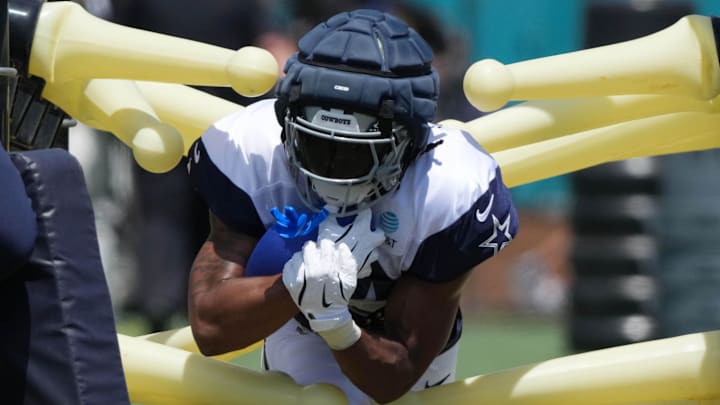Jul 27, 2025; Oxnard, CA, USA; Dallas Cowboys running back Jaydon Blue (34) carries the ball at training camp at the River Ridge Fields. Mandatory Credit: Kirby Lee-Imagn Images