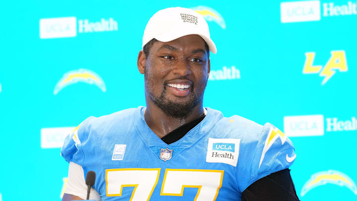 Jul 25, 2025; El Segundo, CA, USA; Los Angeles Chargers guard Zion Johnson (77) during training camp press conference at The Bolt. Mandatory Credit: Kirby Lee-Imagn Images