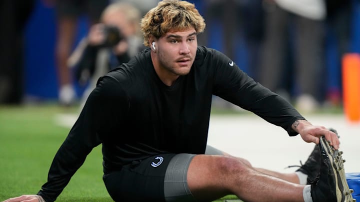Indianapolis Colts defensive end Laiatu Latu (97) warms up before a game against the Detroit Lions on Sunday, Nov. 24, 2024, at Lucas Oil Stadium in Indianapolis.