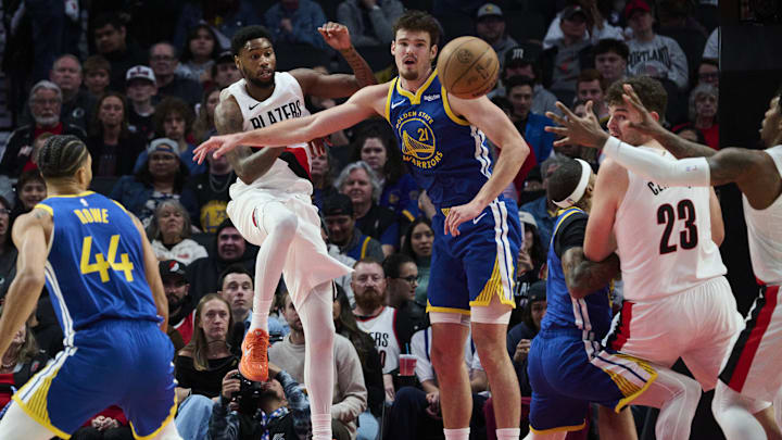 Oct 14, 2025; Portland, Oregon, USA; Portland Trail Blazers guard Blake Wesley (1) passes the ball during the first half against Golden State Warriors center Quinten Post (21) at Moda Center. Mandatory Credit: Troy Wayrynen-Imagn Images