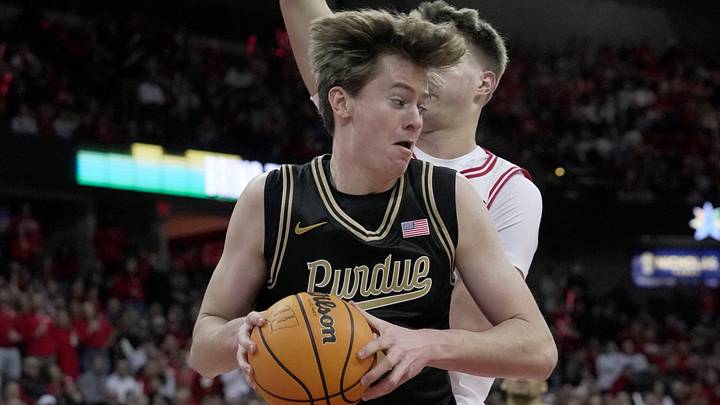 Purdue center Daniel Jacobsen (12) makes a move on Wisconsin forward Nolan Winter (31). Purdue center Daniel Jacobsen (12) makes a move on Wisconsin forward Nolan Winter (31).
