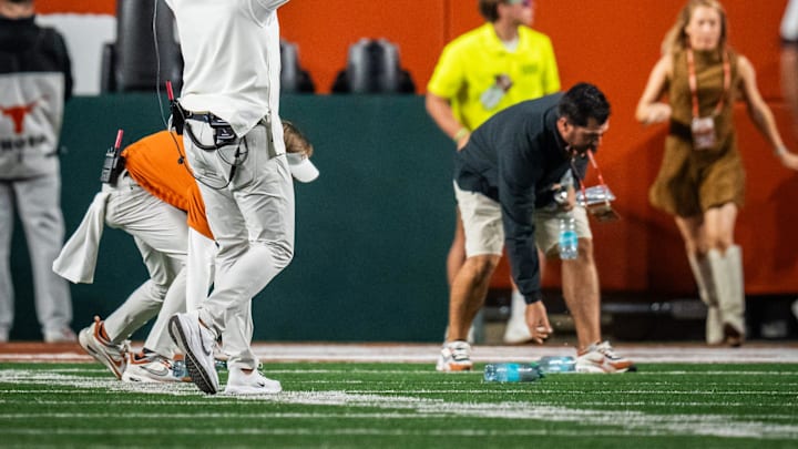 Texas Longhorns head coach Steve Sarkisian walks over the student section to encourage them to stop throwing items on the field after a controversial call by the referees that was later reversed after a review in the third quarter of the Longhorns' game against the Georgia Bulldogs at Darrell K. Royal Texas Memorial Stadium in Austin, Oct. 19, 2024.