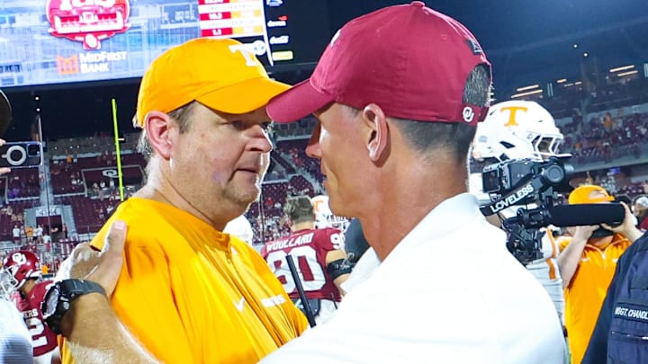 Tennessee Volunteers head coach Josh Heupel (left) shakes hands with Oklahoma Sooners head coach Brent Venables. Tennessee Volunteers head coach Josh Heupel (left) shakes hands with Oklahoma Sooners head coach Brent Venables.