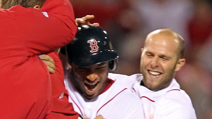 (042010, Boston, MA) Darnell McDonald is congratulated by Boston Red Sox second baseman Dustin (042010, Boston, MA) Darnell McDonald is congratulated by Boston Red Sox second baseman Dustin