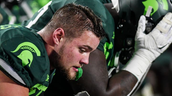 Michigan State's Kenny Willekes sits stunned on the bench after Illinois' go-ahead touchdown late in the fourth quarter on Saturday, Nov. 9, 2019, at Spartan Stadium in East Lansing.

Dsc 6121a