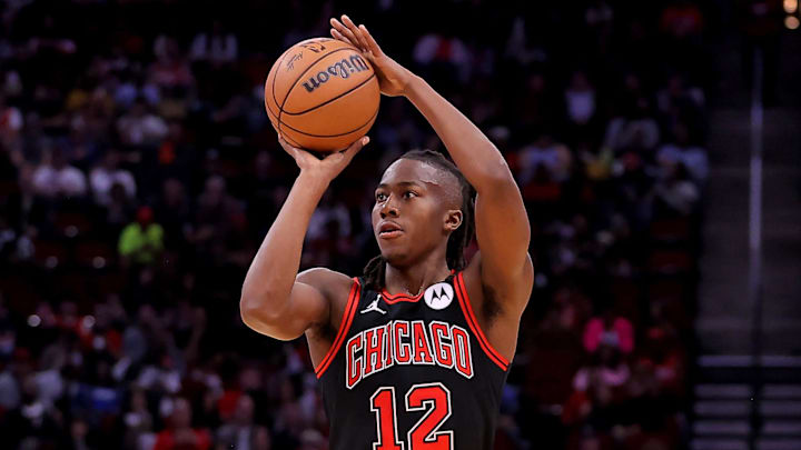 Mar 21, 2024; Houston, Texas, USA; Chicago Bulls guard Ayo Dosunmu (12) shoots outside against the Houston Rockets during the second quarter at Toyota Center. Mandatory Credit: Erik Williams-Imagn Images
