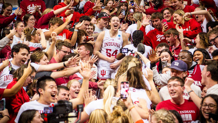 Indiana's Mackenzie Holmes (54) celebrates in the stands with fans after second round NCAA action at Simon Skjodt Assembly Hall on Monday, March 25, 2024.