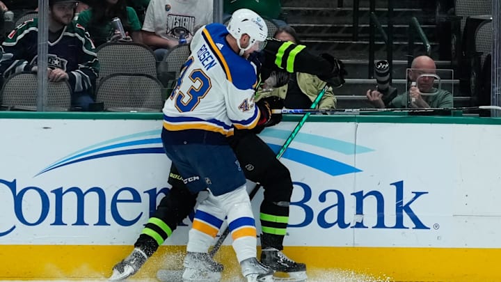 Apr 13, 2023; Dallas, Texas, USA;  Dallas Stars center Radek Faksa (12) is checked by St. Louis Blues defenseman Calle Rosen (43) during the second period at American Airlines Center. Mandatory Credit: Chris Jones-Imagn Images