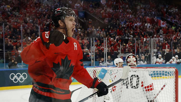 Feb 13, 2026; Milan, Italy;  Connor McDavid of Canada celebrates after scoring their first goal  against Switzerland in men's ice hockey group A play during the Milano Cortina 2026 Olympic Winter Games at Milano Santagiulia Ice Hockey Arena. Mandatory Credit: Geoff Burke-Imagn Images