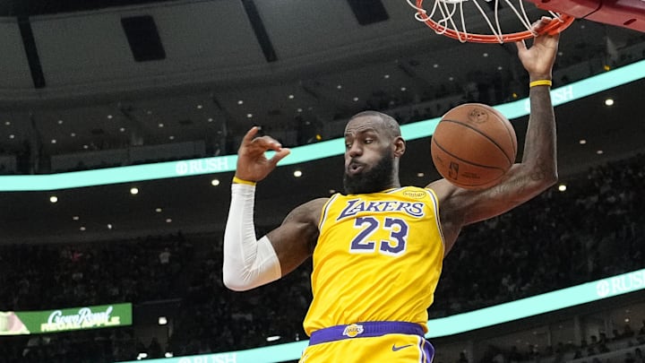 Mar 27, 2025; Chicago, Illinois, USA; Los Angeles Lakers forward LeBron James (23) dunks against the Chicago Bulls during the second half at United Center. Mandatory Credit: David Banks-Imagn Images