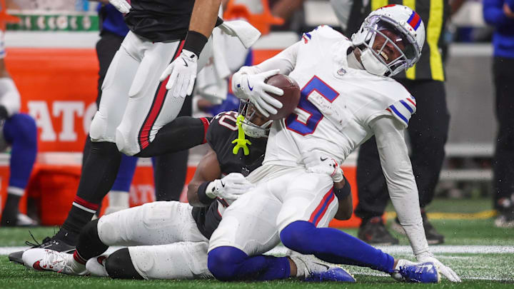 Oct 13, 2025; Atlanta, Georgia, USA; Buffalo Bills wide receiver Josh Palmer (5) is tackled during the first half of a game at Mercedes-Benz Stadium. Oct 13, 2025; Atlanta, Georgia, USA; Buffalo Bills wide receiver Josh Palmer (5) is tackled during the first half of a game at Mercedes-Benz Stadium.