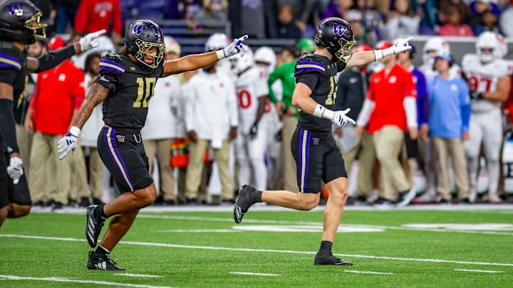 Xe'ree Alexander (10) and Alex McLaughlin (12) share in a Husky moment against Rutgers. 