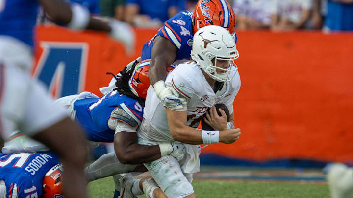 Florida Jamari Lyons takes down Texas quarterback Arch Manning (16) during the second half an NCAA football game in Gainesville, FL on Saturday, October 4, 2025. [Alan Youngblood/Gainesville Sun]