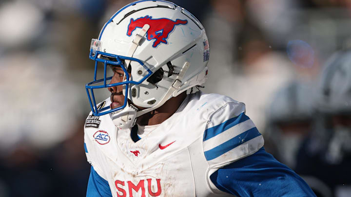 Dec 21, 2024; University Park, Pennsylvania, USA; Southern Methodist Mustangs running back Brashard Smith (1) carries the ball during the second half against the Penn State Nittany Lions at Beaver Stadium. Mandatory Credit: Vincent Carchietta-Imagn Images