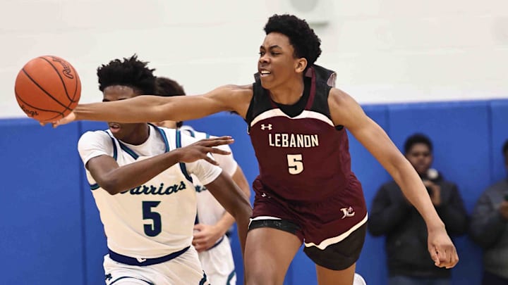 Lebanon forward Anthony Thompson (5) chases after a loose ball during their during their 50-61 loss to Winton Woods Friday, Jan. 5, 2024.